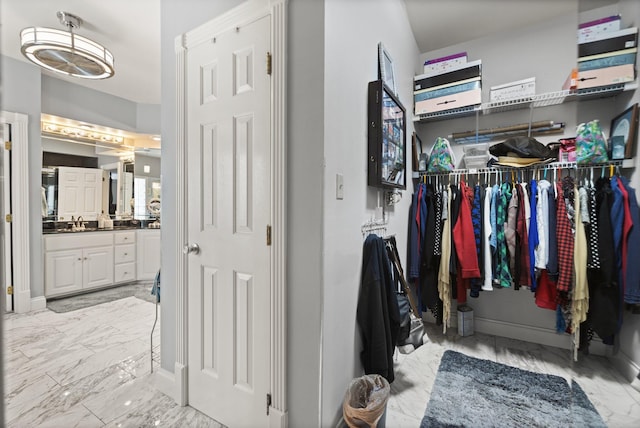 walk in closet featuring sink