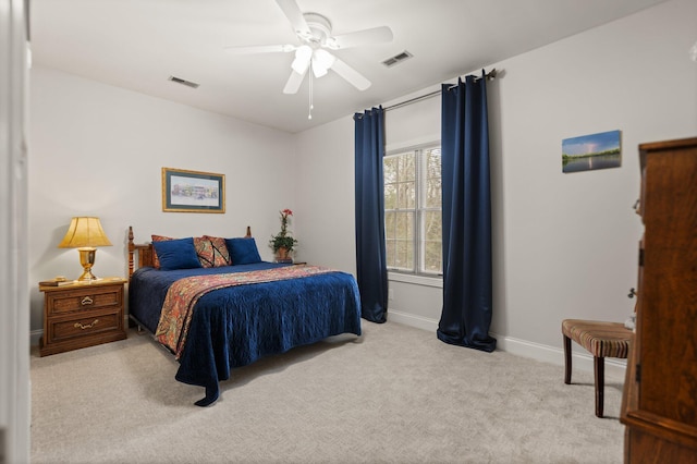 bedroom with light colored carpet and ceiling fan