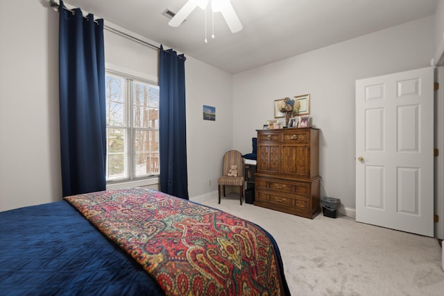 bedroom with light colored carpet and ceiling fan