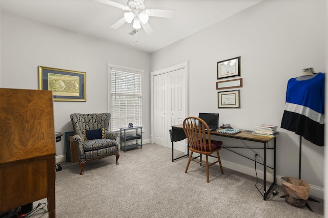 carpeted office featuring ceiling fan