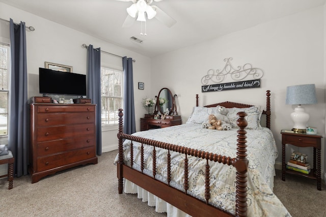 carpeted bedroom with ceiling fan