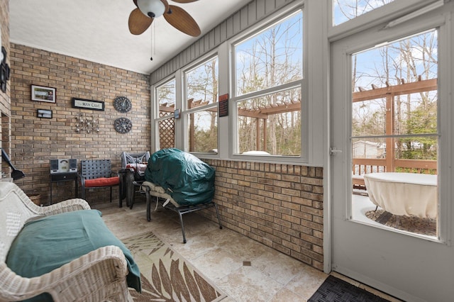 sunroom / solarium with ceiling fan