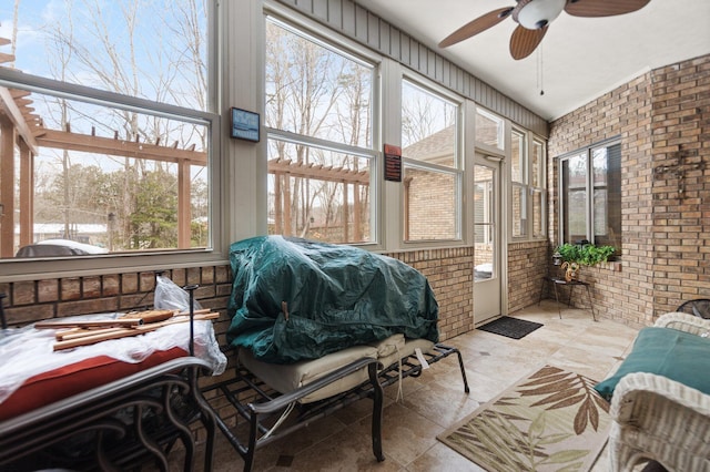 sunroom with ceiling fan and plenty of natural light