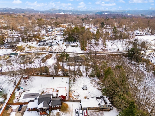 snowy aerial view with a mountain view