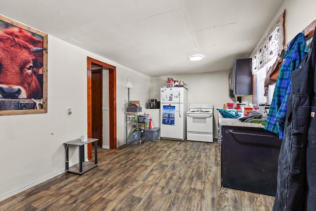 kitchen with white appliances and dark wood-type flooring