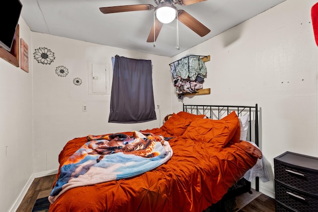 bedroom featuring ceiling fan and dark wood-type flooring