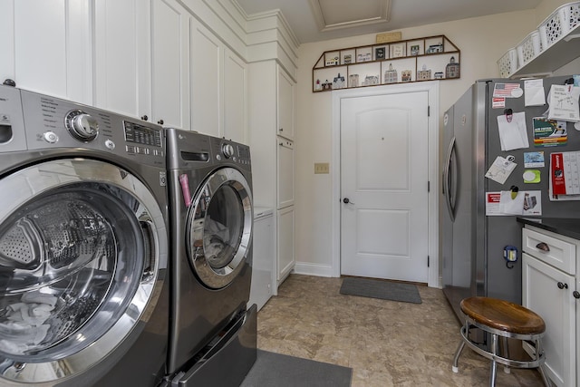 laundry area with cabinet space and washer and dryer