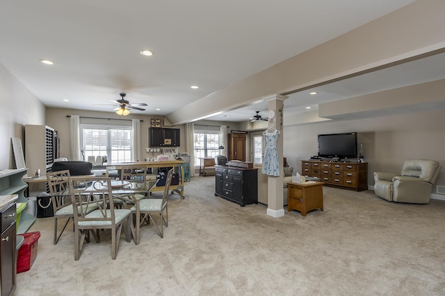 dining room featuring a ceiling fan, recessed lighting, light carpet, and baseboards