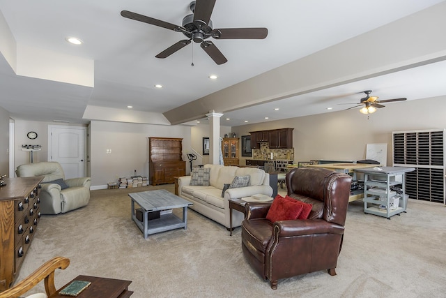 living area with decorative columns, baseboards, light colored carpet, ceiling fan, and recessed lighting