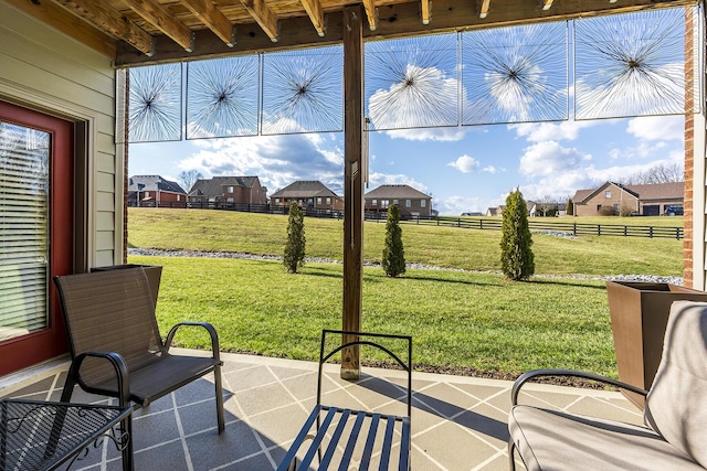 view of patio featuring fence