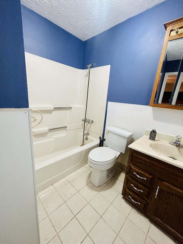 full bathroom featuring tub / shower combination, tile patterned floors, a textured ceiling, and toilet