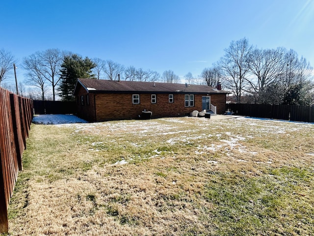 back of house with a yard and a patio area