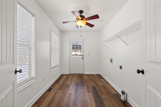 clothes washing area with plenty of natural light, dark hardwood / wood-style floors, hookup for a washing machine, and hookup for an electric dryer