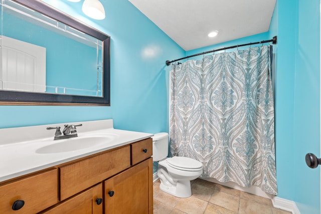 bathroom with toilet, vanity, a shower with curtain, and tile patterned flooring