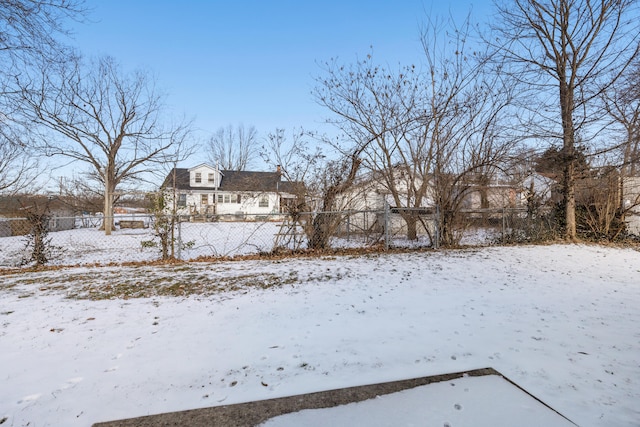 view of yard covered in snow