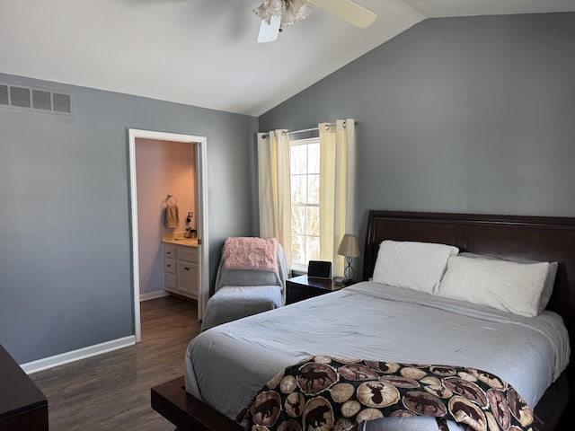 bedroom featuring ceiling fan, lofted ceiling, dark hardwood / wood-style flooring, and ensuite bath