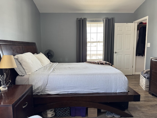 bedroom with hardwood / wood-style floors