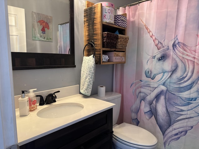 bathroom with vanity and toilet