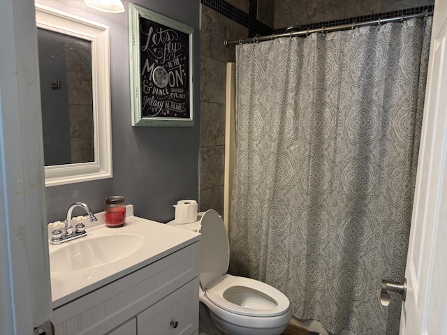 bathroom with vanity, toilet, and a shower with shower curtain