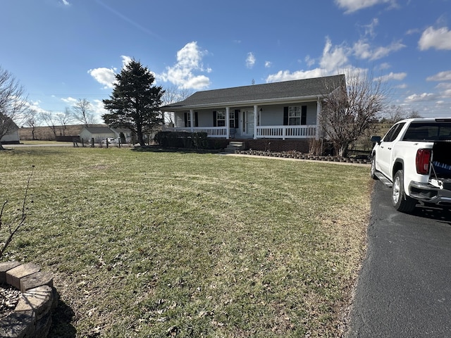 view of front of house featuring a porch and a front yard