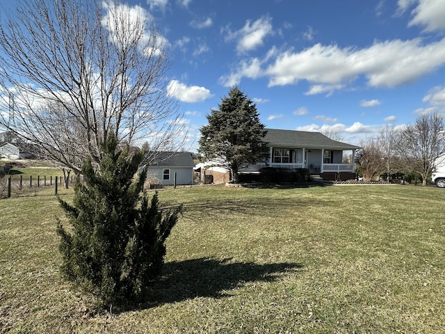 view of yard featuring a porch