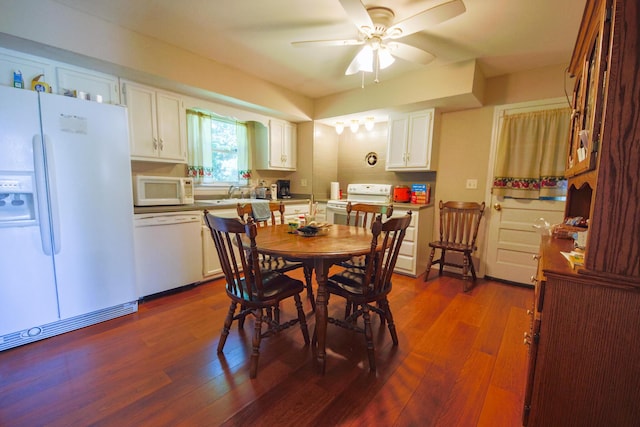 dining area with sink, dark hardwood / wood-style floors, and ceiling fan