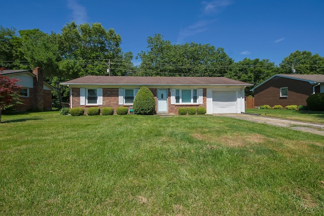 ranch-style home with a garage and a front lawn