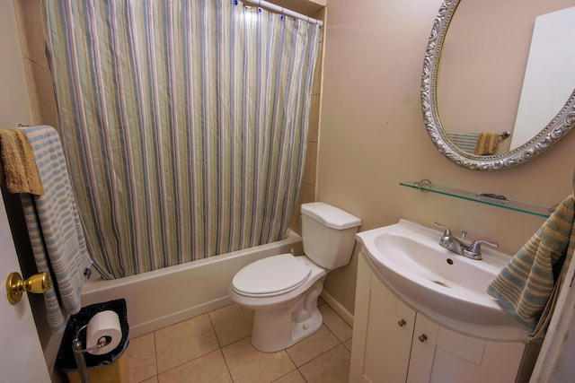 full bathroom with shower / bath combo with shower curtain, toilet, tile patterned floors, and vanity