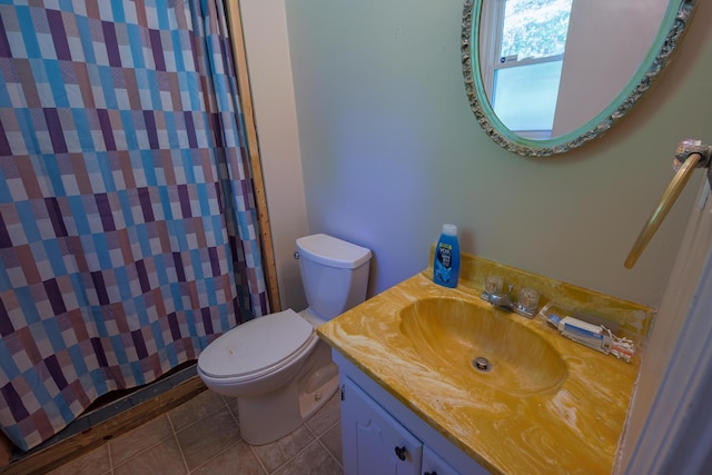 bathroom with vanity, toilet, tile patterned floors, and curtained shower