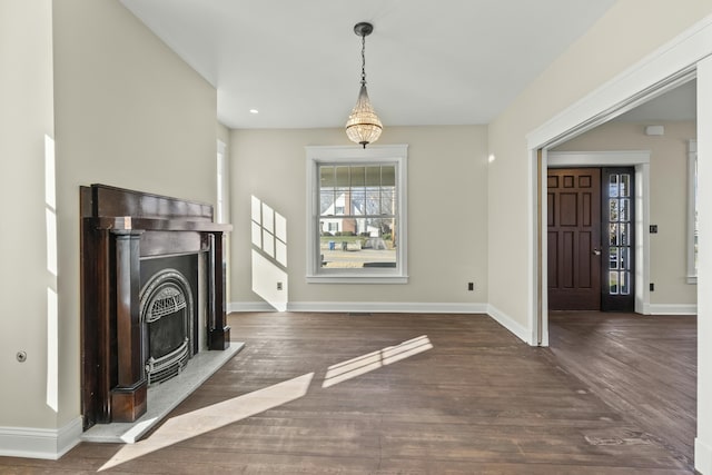 unfurnished living room featuring dark hardwood / wood-style floors