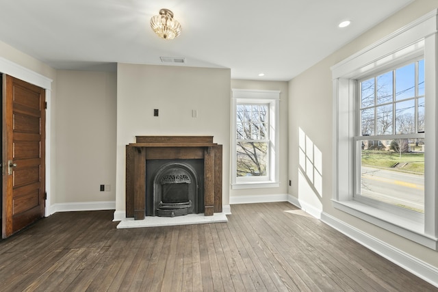 unfurnished living room with hardwood / wood-style floors