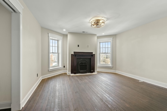 unfurnished living room featuring dark hardwood / wood-style floors