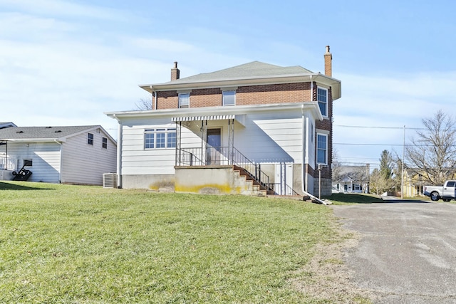 view of front of home with a front lawn