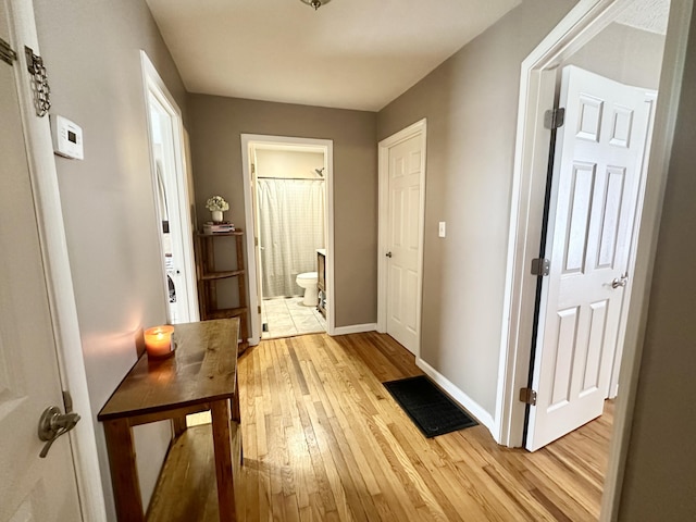 corridor featuring light hardwood / wood-style floors