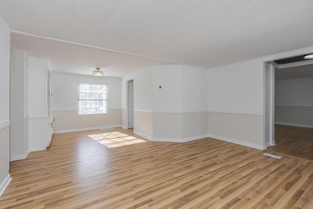 unfurnished room featuring light hardwood / wood-style floors