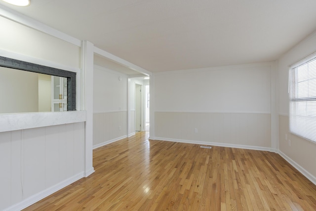 spare room with light hardwood / wood-style flooring