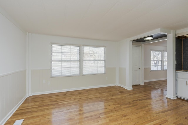 empty room with light hardwood / wood-style floors