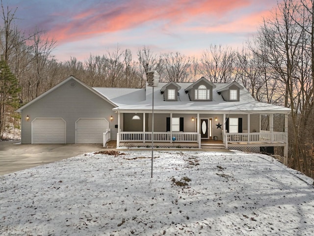 view of front of property with a porch and a garage