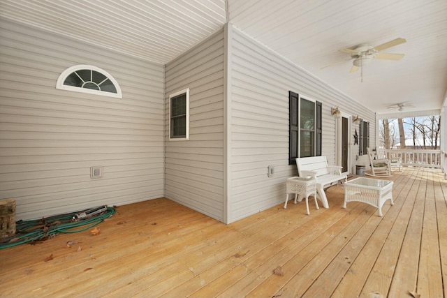 wooden deck with ceiling fan and a porch