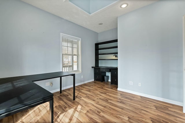 office area with light hardwood / wood-style floors