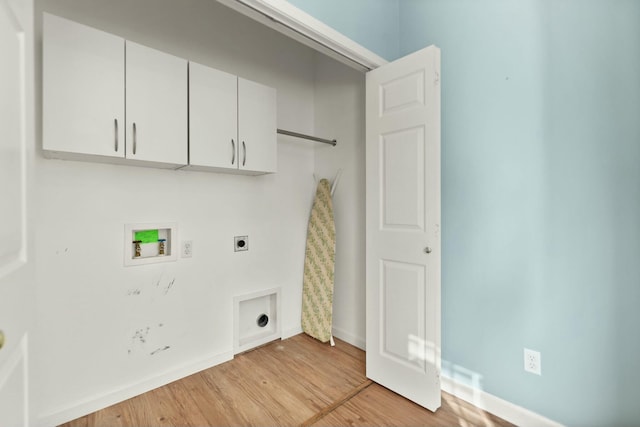 laundry area featuring electric dryer hookup, cabinets, washer hookup, and light hardwood / wood-style flooring