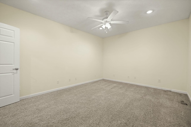 carpeted empty room with ceiling fan