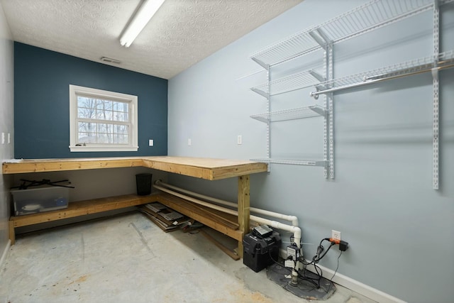 washroom with a textured ceiling