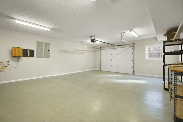 garage featuring a garage door opener and electric panel