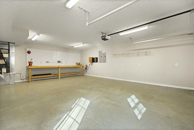 garage with a garage door opener, electric panel, heating unit, and a workshop area