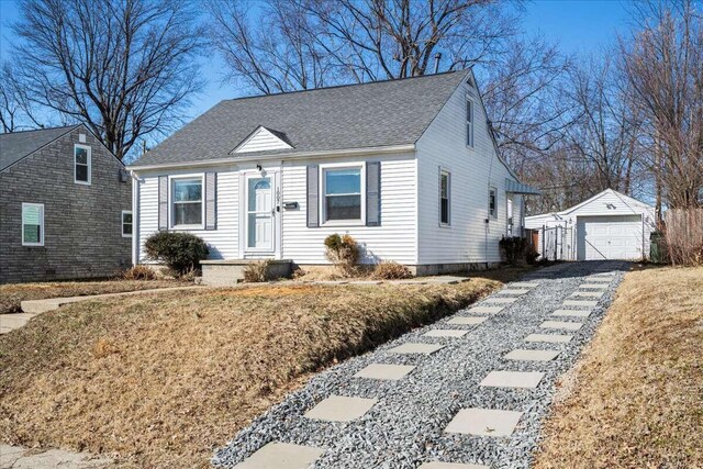 view of front of house featuring an outbuilding and a garage