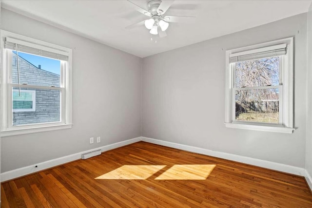 unfurnished room with hardwood / wood-style floors and ceiling fan