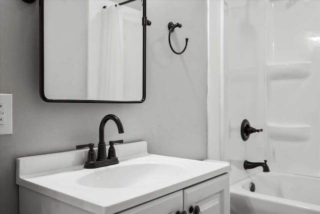 bathroom with vanity and shower / bath combo