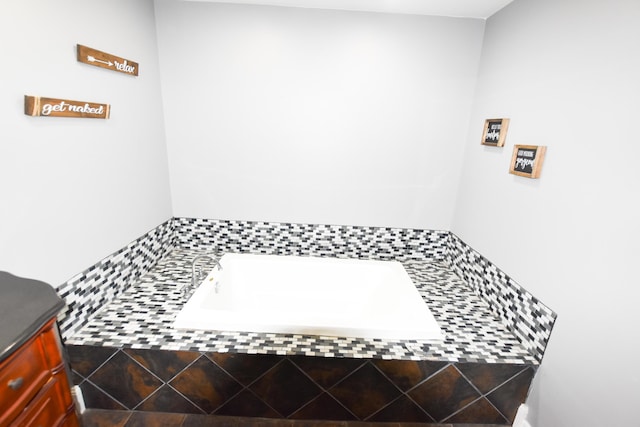 bathroom featuring a relaxing tiled tub