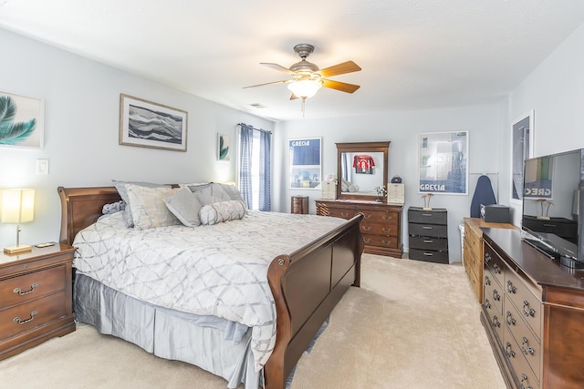 bedroom featuring light colored carpet and ceiling fan